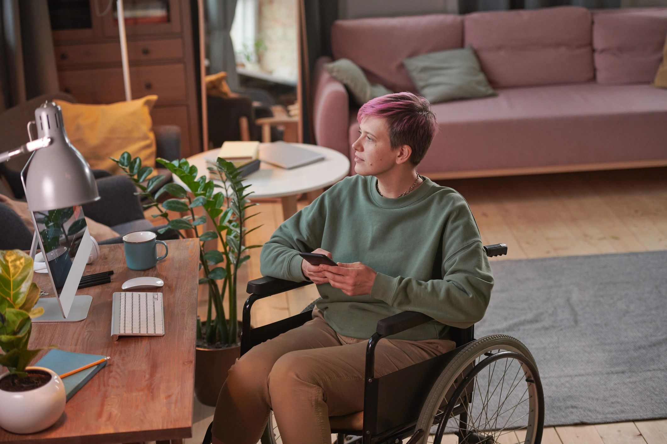 Wheelchair user operating mobility controls indoors